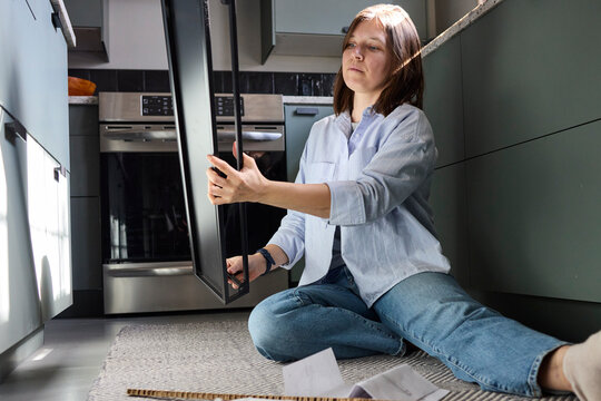 Woman working on setting up furniture