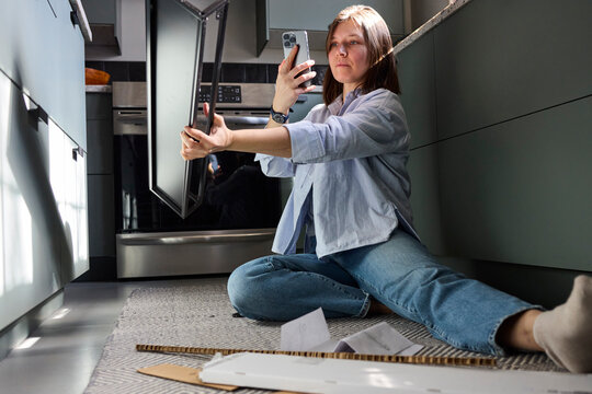 Woman working on setting up furniture