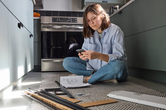 Woman working on setting up furniture