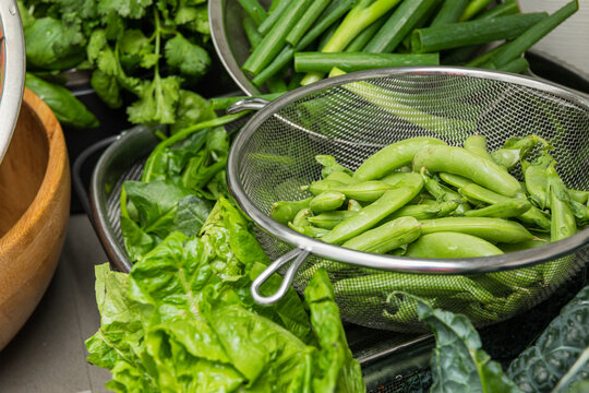 Assorted greens and peas beautifully arranged
