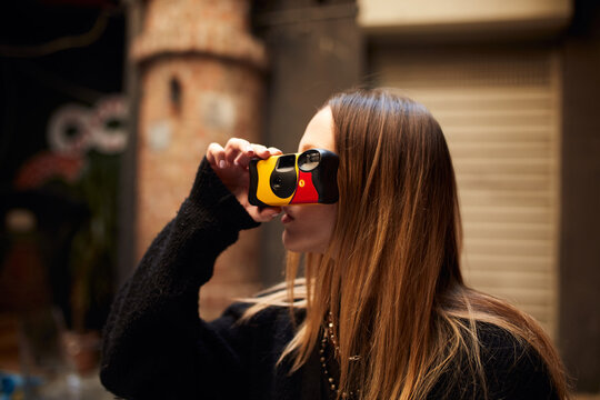 Woman uses disposable camera