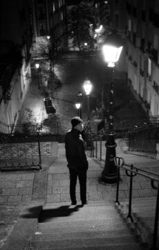 Man going down the stairs in Montmartre