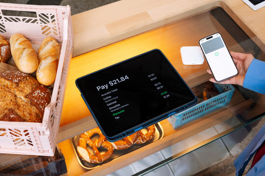 Payment with Phone. Pay Screen and NFC Reader at Caf&eacute; Count