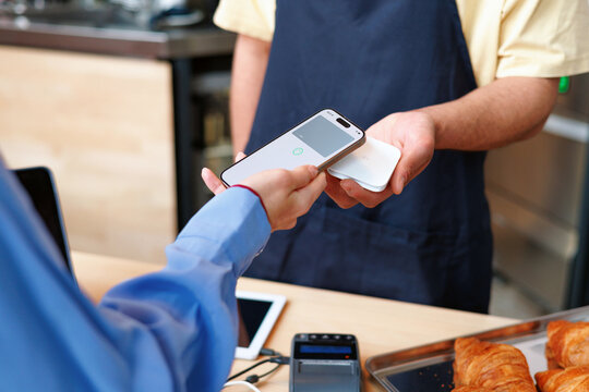 Mobile Payment  with Phone at Small Bakery Counter