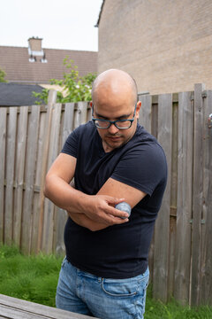 Man with diabetes, is changing his continuous blood sugar sensor