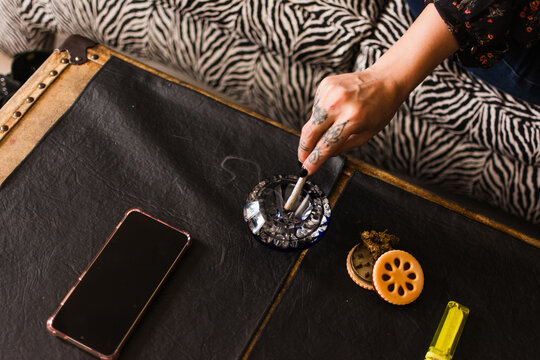 Anonymous woman using cannabis at home
