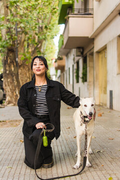 Proud dog owner and her greyhound