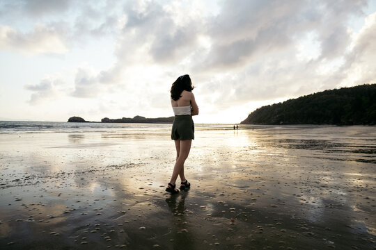 Woman walking on the beach in Cape Hillsborough