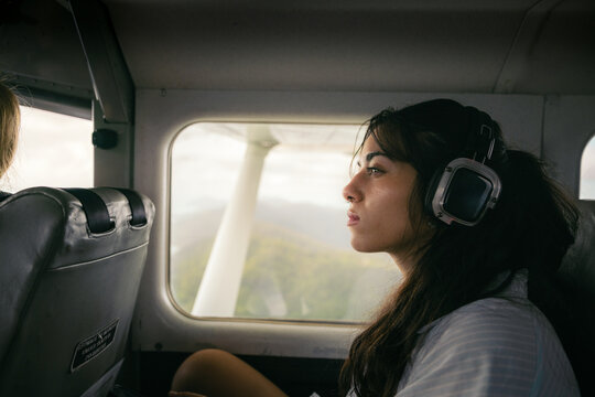 Young woman flying on a small plane
