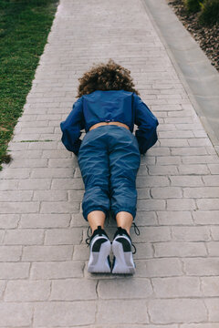 Woman doing push-ups outdoors