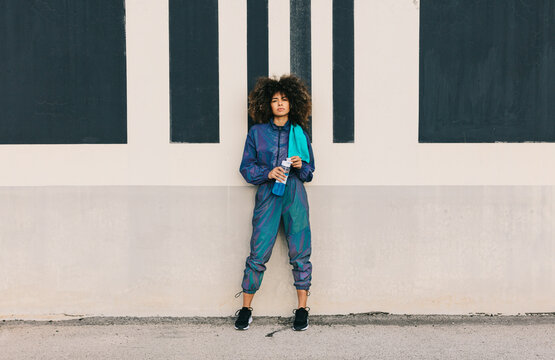 Woman leaning with reusable bottle