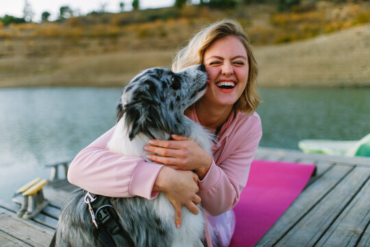  Woman with dog by lake