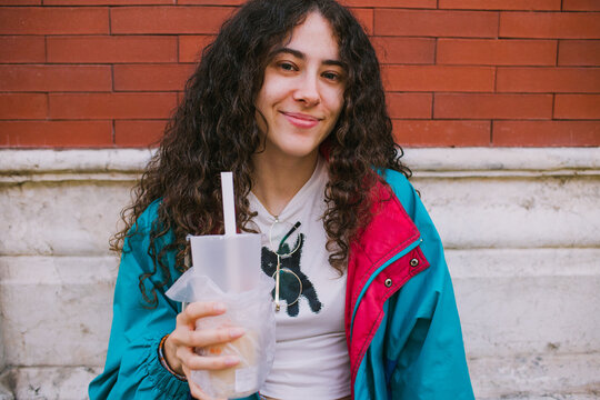 Woman smiling with bubble tea