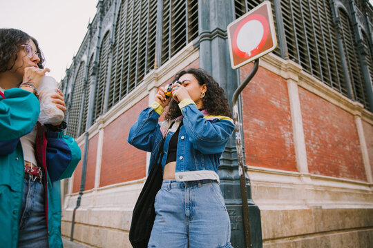Friends with camera and bubble tea