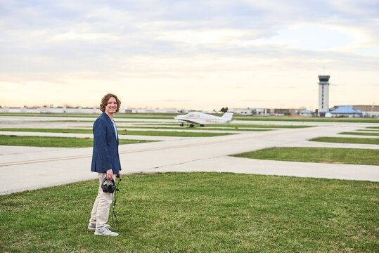 Young student pilot on the runway