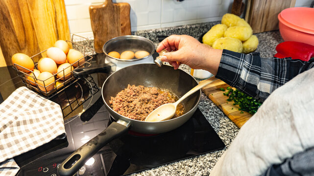 Woman throwing white pepper