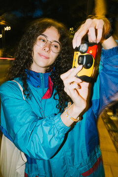 Girl with disposable camera