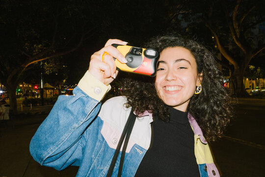 Woman smiling with camera