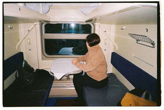 A woman sitting on a train