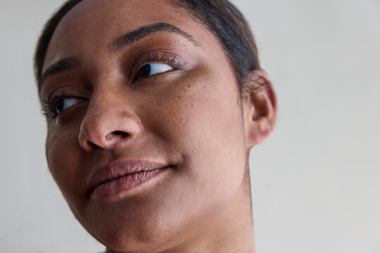 Young woman with no makeup in studio 