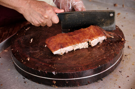 Closeup of roast pork being cut