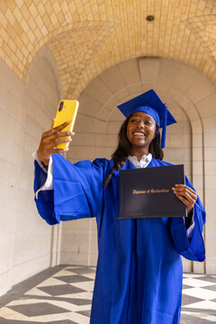 Black Teenager school graduate taking cellphone Selfie 