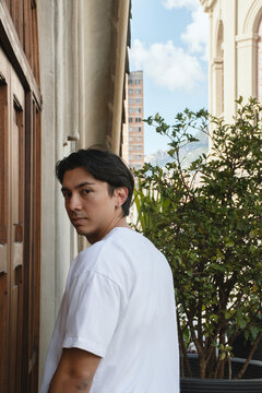 man posing in a terrace outside