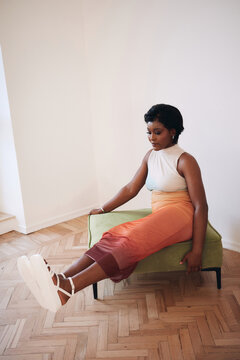 Fashion portrait of woman sit on sofa