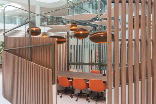 Private Office Meeting Booth With Orange Chairs