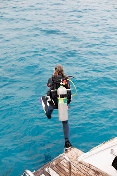 Scuba Diver Making Giant Stride From a Boat