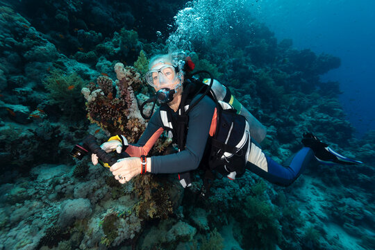 Portrait of Woman Scuba Diving Underwater