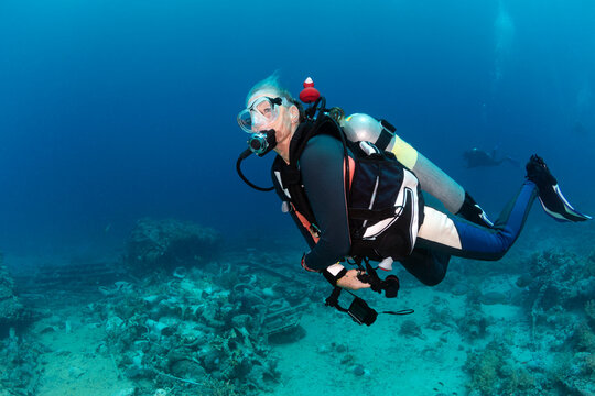 Woman Scuba Diving Underwater