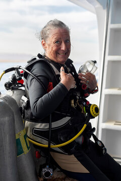 Happy Woman Scuba Diver After a Dive