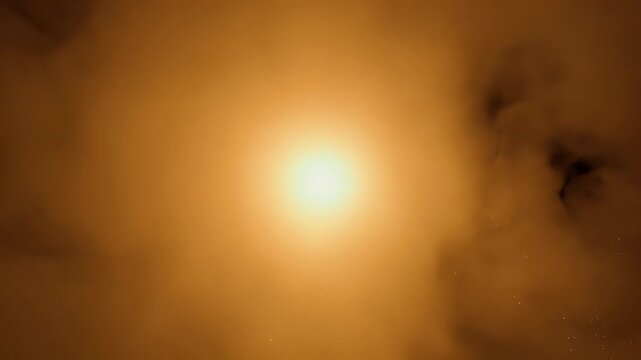 Bright light bursts through swirling ochre and dark smoky clouds