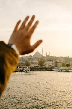 A hand on a city background