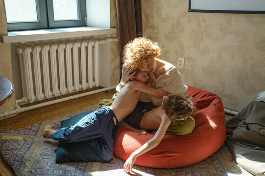 
mother hugs her children