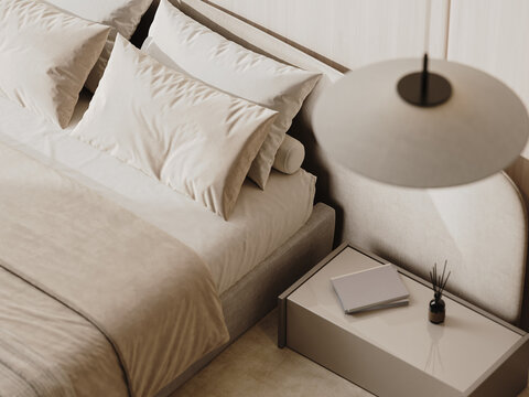 Top view of a bed and bedside table, fancy hotel room details