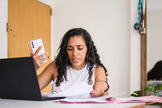 Latina woman stress about finance