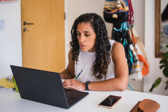 Busy Woman working with computer at home