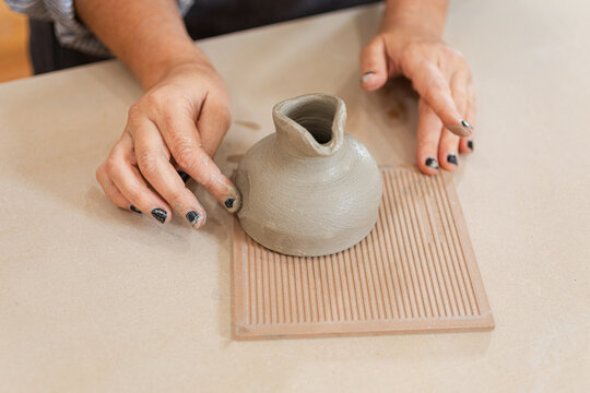 Creating a beautiful ceramic piece on a tile