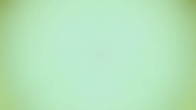 Abstract soft green and yellow gradient background with subtle pixelation effect.