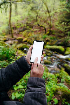 Phone with white screen POV in nature