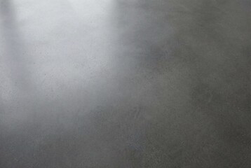 Dark grey polished concrete surface texture with a smooth finish and consistent pattern © Meow Creations