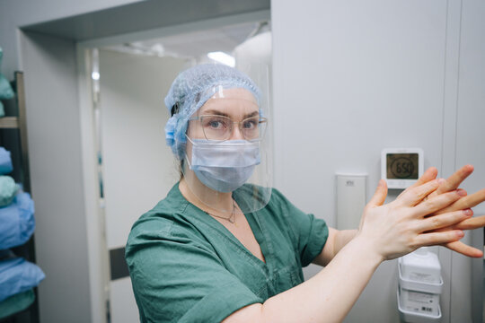 Doctor washes hands before the operation