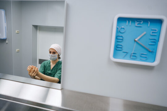 Doctor washes hands before the operation