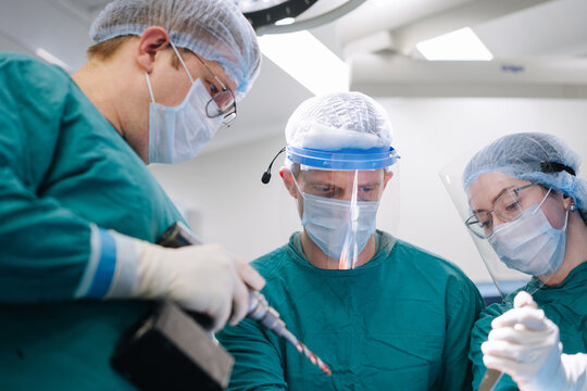 Three surgeons during the surgery
