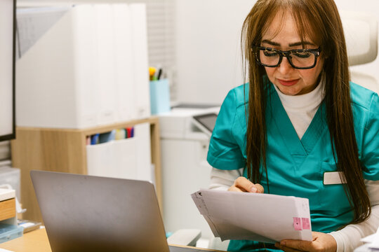 practitioner nurse Reviewing Patient Notes