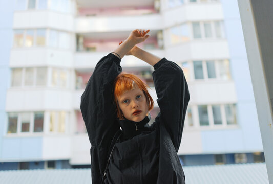 Title

Young Woman With Outstretched Arms Against Urban Building