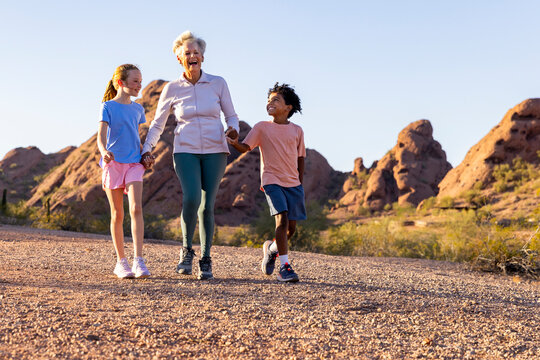 Senior hand hold family hike groupshot 