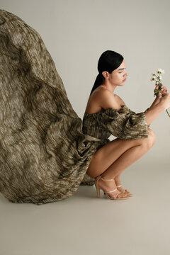 Nonbinary person in Elegant flowing dress